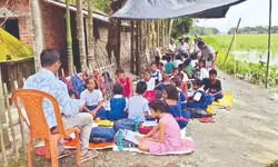 Flood-hit Jalpaiguri school holds classes on roadside