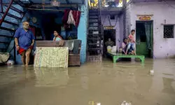 Cots float, families wade through water as Yamuna rises in Delhi