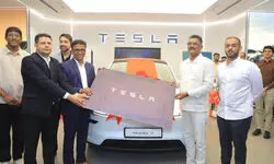 Maharashtra transport minister becomes first Tesla Model Y owner in India, vows to raise awareness about EVs
