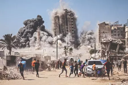Israel strikes high-rise building, threatens to hit more in Gaza