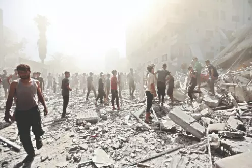 Israeli troops press forward into Gaza City as Palestinians flee