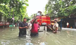 City paralysed: Firhad Hakim cites swollen Hooghly River, backflow for waterlogging City paralysed: Firhad Hakim cites swollen Hooghly River, backflow for waterlogging