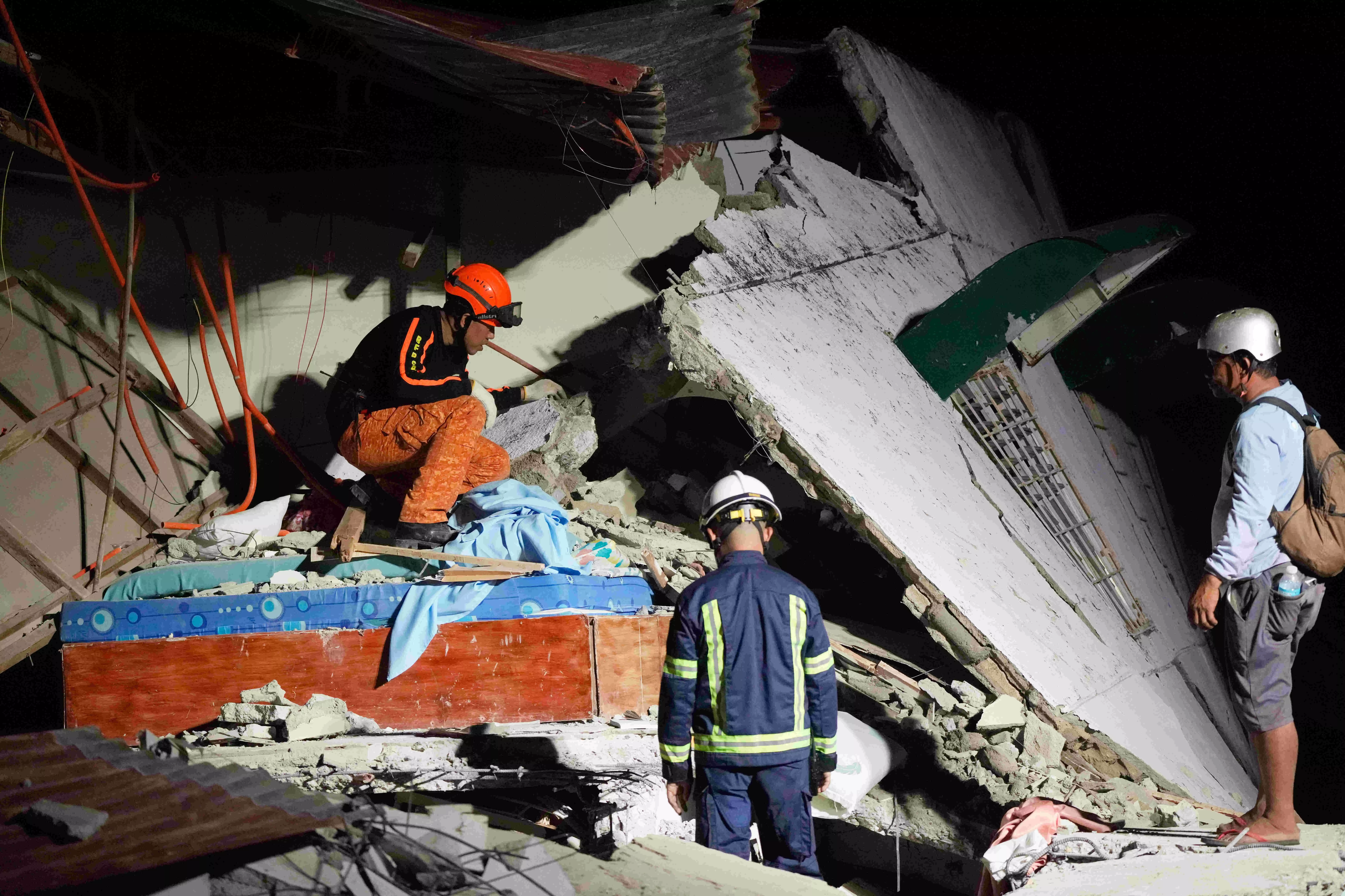 Rescuers desperately search for survivors of earthquake in the Philippines that killed at least 72
