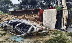Paddy-laden truck overturns on car in UP, two killed