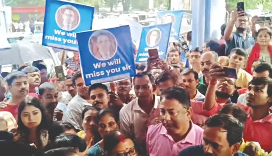 In rare scene, staff brave rain to bid farewell to Malda DM Nitin Singhania In rare scene, staff brave rain to bid farewell to Malda DM Nitin Singhania
