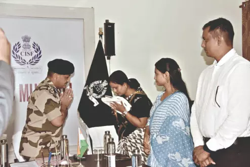 CISF hands over enhanced SBI CAPSP benefits CISF hands over enhanced SBI CAPSP benefits