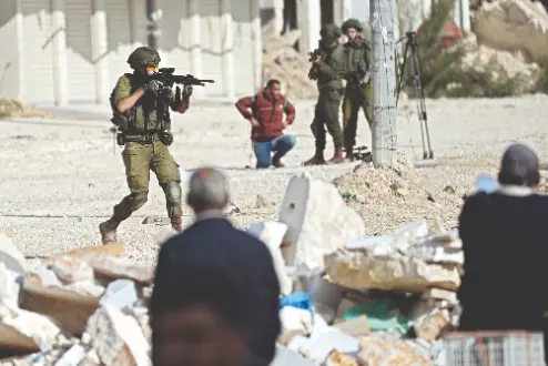 Israeli forces kill at least 13 in southern Syria raid