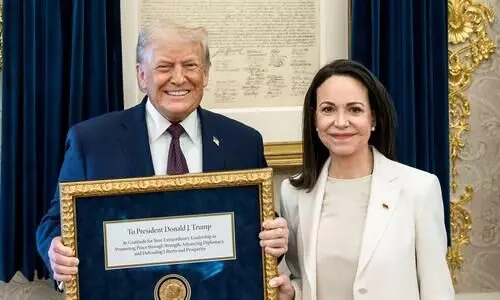 Venezuelan Nobel Peace Prize winner presents her medal to Trump