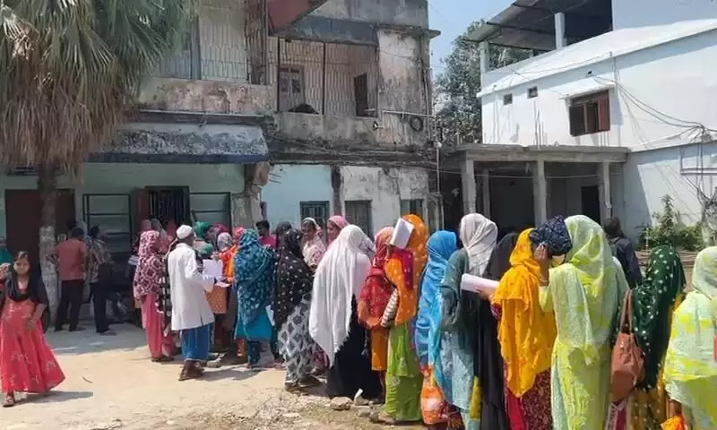 Voters queue at Dinhata Block office for submitting documents to tribunal Voters queue at Dinhata Block office for submitting documents to tribunal